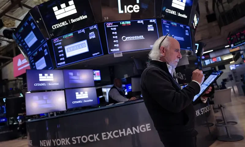 A trader works on the trading floor at The New York Stock Exchange (NYSE) following the Federal Reserve rate announcement, in New York City, U.S., September 18, 2024. REUTERS/Andrew Kelly