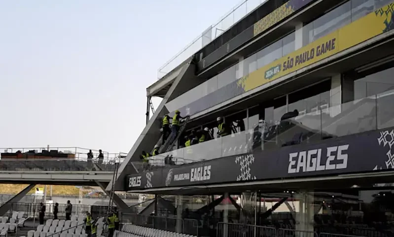 Workers erect signage prior to the 2024 NFL Sao Paolo game between the Philadelphia Eagles and the Green Bay Packers at Neo Química Arena. Mandatory Credit: Kirby Lee-Imagn Images