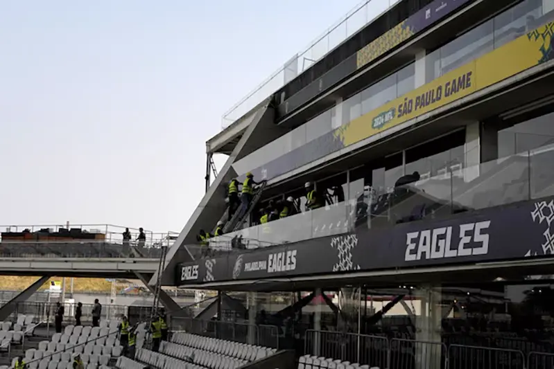 Workers erect signage prior to the 2024 NFL Sao Paolo game between the Philadelphia Eagles and the Green Bay Packers at Neo Química Arena. Mandatory Credit: Kirby Lee-Imagn Images