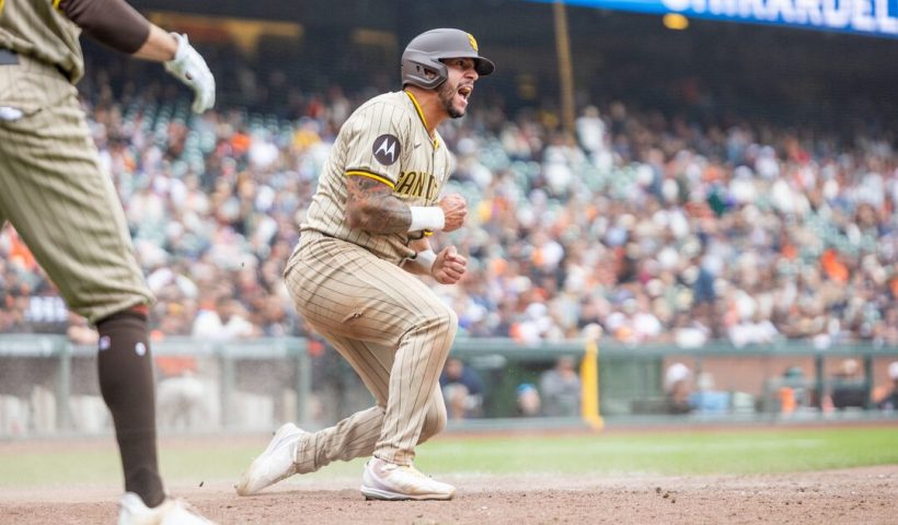 San Diego Padres outfielder David Peralta (21) scores during the tenth inning against the San Francisco Giants at Oracle Park. Mandatory Credit: Bob Kupbens-Imagn Images