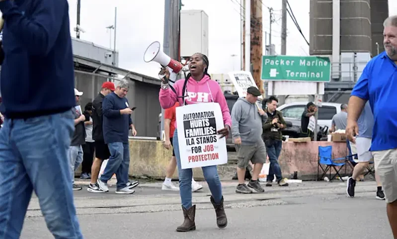 Dockworkers picket after a shipping port strike went into effect across the East Coast at the Packer Avenue Marine Terminal, Philadelphia, Pennsylvania, U.S., October 1, 2024. REUTERS/Matthew Hatcher/File Photo