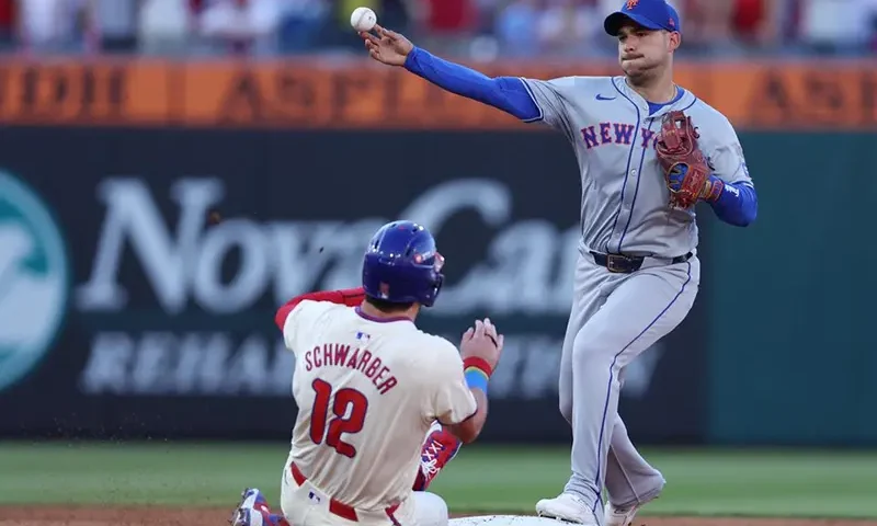 New York Mets second baseman Jose Iglesias (11) forces out Philadelphia Phillies designated hitter Kyle Schwarber (12) in the third inning in game one of the NLDS for the 2024 MLB Playoffs at Citizens Bank Park. Mandatory Credit: Bill Streicher-Imagn Images