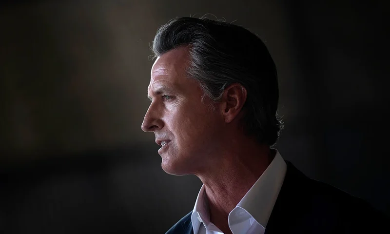 California Governor Gavin Newsom speaks as US President Joe Biden visits the state at Sacramento Mather Airport in Mather, California on September 13, 2021. - US President Joe Biden kicked off a visit to scorched western states Monday to hammer home his case on climate change and big public investments, as well as to campaign in California's recall election. (Photo by Brendan Smialowski / AFP) (Photo by BRENDAN SMIALOWSKI/AFP via Getty Images)