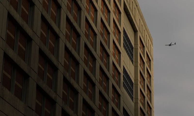 An airplane flies over the Metropolitan Detention Center where Ghislaine Maxwell is being held, in Brooklyn, New York on November 28, 2021. (Photo by Yuki IWAMURA / AFP) (Photo by YUKI IWAMURA/AFP via Getty Images)