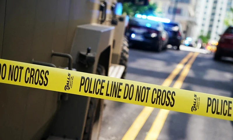 Police tape blocks off the area after a man shot four people in a building in Atlanta, Georgia, on May 3, 2023. One person was killed and three were injured in the southern US city of Atlanta on Wednesday when a gunman opened fire inside a building, police said, in the latest gun violence to hit the country. (Photo by Elijah NOUVELAGE / AFP) (Photo by ELIJAH NOUVELAGE/AFP via Getty Images)