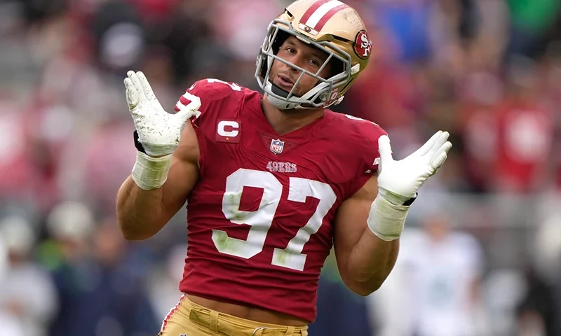SANTA CLARA, CALIFORNIA - SEPTEMBER 18: Nick Bosa #97 of the San Francisco 49ers reacts after sacking Geno Smith #7 of the Seattle Seahawks during the fourth quarter at Levi's Stadium on September 18, 2022 in Santa Clara, California. (Photo by Thearon W. Henderson/Getty Images)