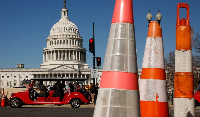 WASHINGTON, DC - MARCH 20: Tourists travel along 1st Street near the East Front of the U.S. Capitol building on March 20, 2023 in Washington, DC. The security posture in Washington appeared normal on Monday after former President Donald Trump called for protests after he announced on social media that he expected to be arrested this week and charged with breaking campaign finance laws for paying an adult film star hush money during the 2016 presidential election. (Photo by Chip Somodevilla/Getty Images)