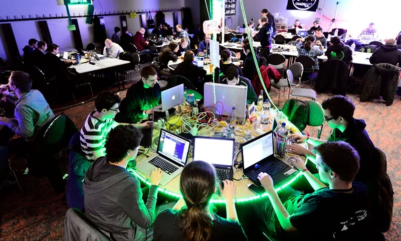 HAMBURG, GERMANY - DECEMBER 28: Participants work at their laptops at the annual Chaos Computer Club (CCC) computer hackers' congress, called 29C3, on December 28, 2012 in Hamburg, Germany. The 29th Chaos Communication Congress (29C3) attracts hundreds of participants worldwide annually to engage in workshops and lectures discussing the role of technology in society and its future. (Photo by Patrick Lux/Getty Images)