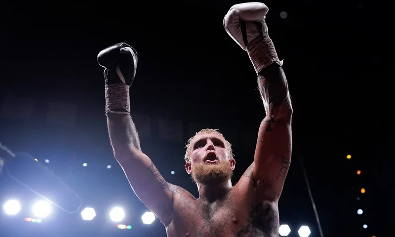 DALLAS, TEXAS - AUGUST 05: Jake Paul raises his arms in the air after his fight against Nate Diaz at American Airlines Center on August 05, 2023 in Dallas, Texas. (Photo by Sam Hodde/Getty Images)