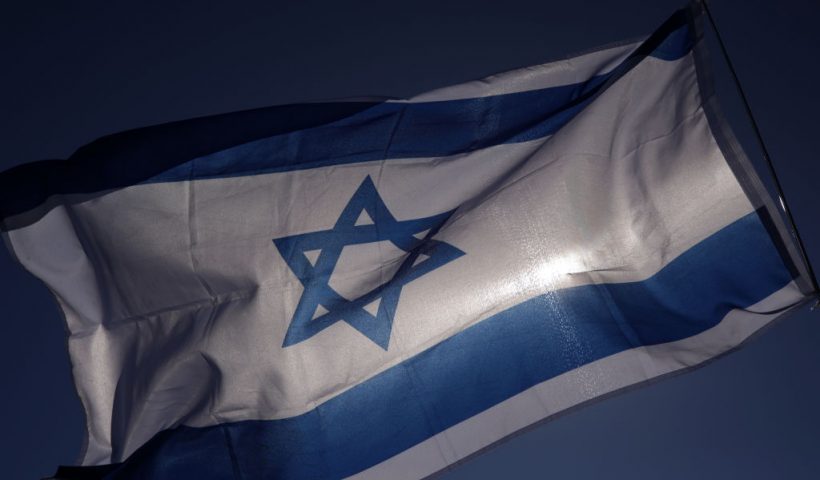 WASHINGTON, DC - NOVEMBER 14: An Israel flag flies during the March for Israel on the National Mall November 14, 2023 in Washington, DC. The large pro-Israel gathering comes as the Israel-Hamas war enters its sixth week following the October 7 terrorist attacks by Hamas. (Photo by Alex Wong/Getty Images)