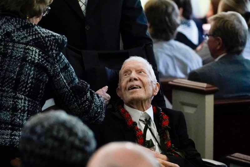 Former US President Jimmy Carter departs a funeral service for former US First Lady Rosalynn Carter, at Maranatha Baptist Church in Plains, Georgia, on November 29, 2023. Former US first lady Rosalynn Carter, who died last week at the age of 96, will be buried at her home in Georgia later on November 29, 2023, following a private funeral service attended by her ailing husband Jimmy Carter. The burial comes after a public ceremony on November 28, 2023, in Atlanta where President Joe Biden and former president Bill Clinton, as well as all five living first ladies, paid their final respects. (Photo by Alex Brandon / POOL / AFP) (Photo by ALEX BRANDON/POOL/AFP via Getty Images)