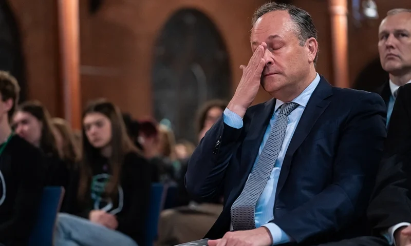 WASHINGTON, DC - DECEMBER 6: Second Gentleman Doug Emhoff, husband of Vice President Kamala Harris, reacts as gun violence survivors speak during a national vigil on December 6, 2023 in Washington, DC. The vigil marked the 11th anniversary of the Sandy Hook Elementary School shooting in Newtown, Connecticut, which left 26 people dead. (Photo by Nathan Howard/Getty Images)