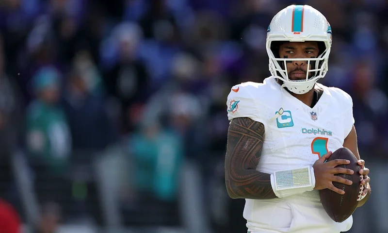 BALTIMORE, MARYLAND - DECEMBER 31: Quarterback Tua Tagovailoa #1 of the Miami Dolphins warms up against the Baltimore Ravens at M&T Bank Stadium on December 31, 2023 in Baltimore, Maryland. (Photo by Rob Carr/Getty Images)