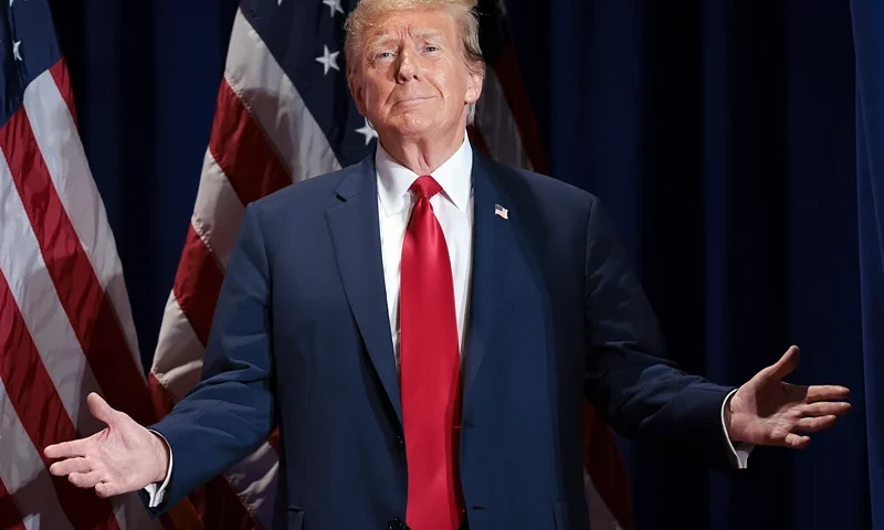 Republican presidential candidate and former President Donald Trump reacts to supporters as he arrives on stage during a Get Out the Vote Rally March 2, 2024 in Richmond, Virginia. Sixteen states, including Virginia, will vote during Super Tuesday on March 5. (Photo by Win McNamee/Getty Images)