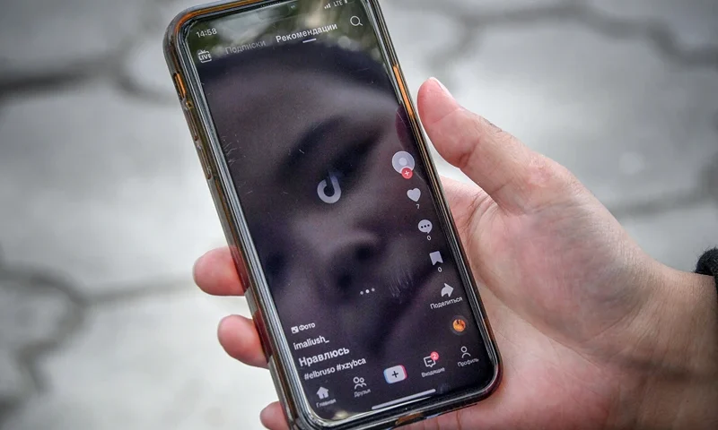 A girl shows a mobile phone where Tik Tok reports problems to be accessed, in Bishkek on April 19, 2024. The ban in Kyrgyzstan -- a small, ex-Soviet country of seven million people -- is just one small part of a global backlash from politicians and regulators to the app's surging popularity. Owned by Chinese group ByteDance, TikTok is embroiled in a string of battles over issues ranging from the mental health effects of the app to the data it allegedly scoops up from users. (Photo by Vyacheslav OSELEDKO / AFP) (Photo by VYACHESLAV OSELEDKO/AFP via Getty Images)