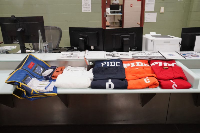 Clothes and personal hygiene items provided to detainees are displayed during a media tour of the Port Isabel Detention Center (PIDC), hosted by U.S. Immigration and Customs Enforcement (ICE) Harlingen Enforcement and Removal Operations (ERO), in Los Fresnos, Texas, June 10, 2024. Behind barbed metal fences topped with barbed wire, men play volleyball and basketball at a detention center in Texas, passing time as they wait to hear if they will be allowed to stay in the United States. They are among more than 1,000 housed at this former naval base in the US city of Los Fresnos, just a few miles from the Mexican border, which they all crossed illegally. (Photo by Veronica G. Cardenas / POOL / AFP) (Photo by VERONICA G. CARDENAS/POOL/AFP via Getty Images)