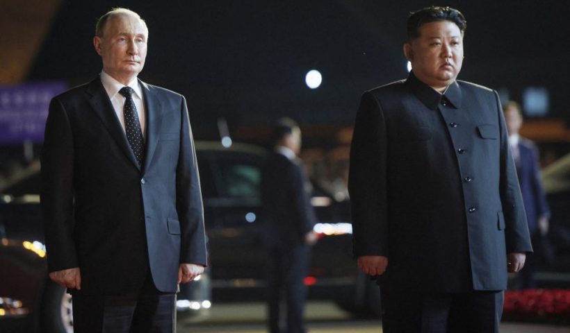 In this pool photograph distributed by the Russian state agency Sputnik, Russian President Vladimir Putin (L) stands beside North Korea's leader Kim Jong Un (R) at the airport in Pyongyang, on June 19, 2024. (Photo by Gavriil GRIGOROV / POOL / AFP) / -- Editor's note : this image is distributed by the Russian state owned agency Sputnik - (Photo by GAVRIIL GRIGOROV/POOL/AFP via Getty Images)