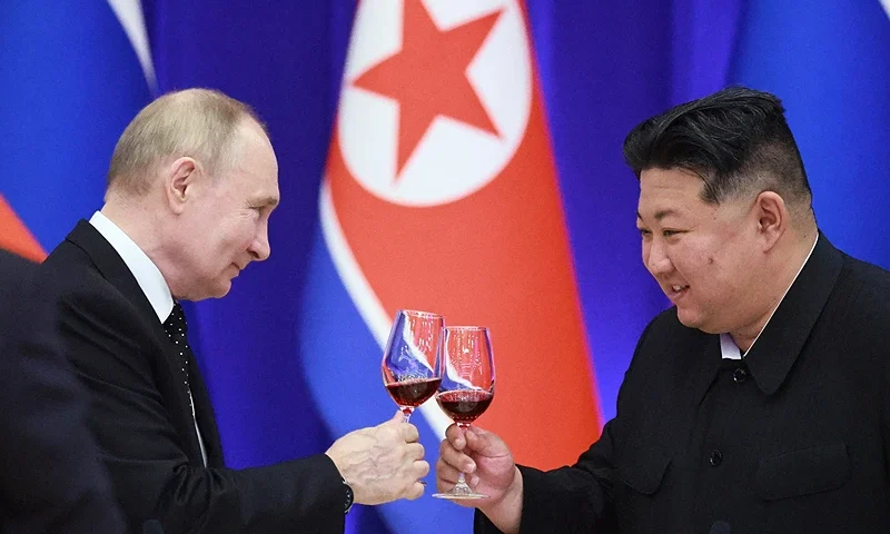 TOPSHOT - In this pool photograph distributed by the Russian state agency Sputnik, Russian President Vladimir Putin and North Korean leader Kim Jong Un toast during a reception at the Mongnangwan Reception House in Pyongyang on June 19, 2024. Putin enjoyed a red carpet welcome, a military ceremony and an embrace from North Korea's Kim Jong Un during a state visit to Pyongyang where they both pledged to forge closer ties. (Photo by Vladimir Smirnov / POOL / AFP) / -- Editor's note : this image is distributed by the Russian state owned agency Sputnik -- (Photo by VLADIMIR SMIRNOV/POOL/AFP via Getty Images)