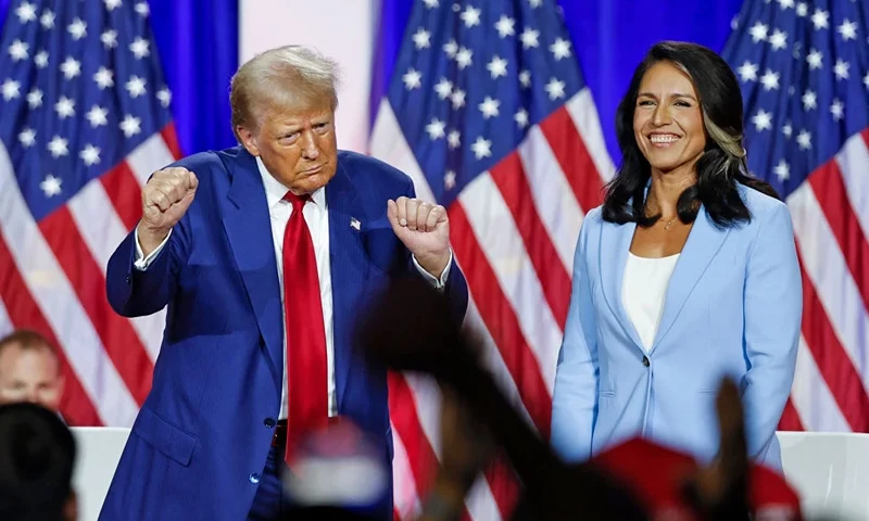 TOPSHOT - Former US President and Republican presidential candidate Donald Trump (L) dances as he leaves the stage after speaking alongside former US Representative Tulsi Gabbard during a town hall meeting in La Crosse, Wisconsin, on August 29, 2024. (Photo by KAMIL KRZACZYNSKI / AFP) (Photo by KAMIL KRZACZYNSKI/AFP via Getty Images)