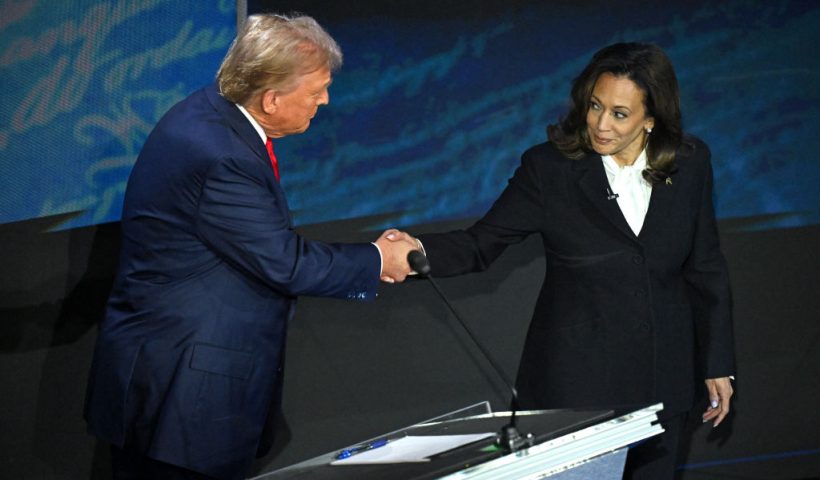 US Vice President and Democratic presidential candidate Kamala Harris (R) shakes hands with former US President and Republican presidential candidate Donald Trump during a presidential debate at the National Constitution Center in Philadelphia, Pennsylvania, on September 10, 2024. (Photo by SAUL LOEB / AFP) (Photo by SAUL LOEB/AFP via Getty Images)