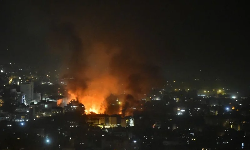 TOPSHOT - Smoke billows from the site of an Israeli airstrike that targeted a neighborhood in Beirut's southern suburb early on September 28, 2024. The Israeli army said September 28 that it killed the commander of Hezbollah's missile unit in southern Lebanon in an air strike, along with his deputy and several other leaders of the Iran-backed movement. Israeli fighter jets killed "Muhammad Ali Ismail, the commander of Hezbollah's missile unit in southern Lebanon, and his deputy," the military said in a statement on Telegram that added, "other Hezbollah commanders and terrorists were eliminated". (Photo by Fadel ITANI / AFP) (Photo by FADEL ITANI/AFP via Getty Images)