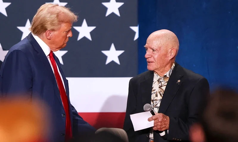 Former US President and Republican presidential candidate Donald Trump receives a Purple Heart medal from a Vietnam veteran (R) during a town hall event at the Crown Complex in Fayetteville, North Carolina, on October 4, 2024. (Photo by Logan Cyrus / AFP) (Photo by LOGAN CYRUS/AFP via Getty Images)