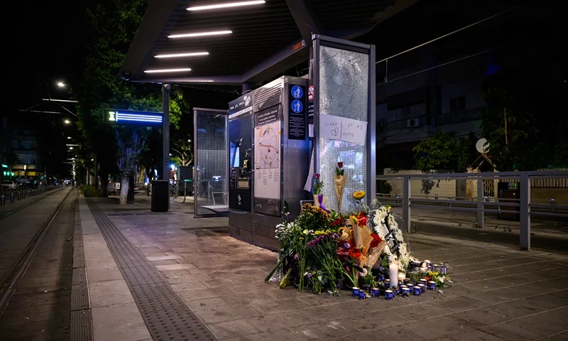 TEL AVIV, ISRAEL - OCTOBER 02: Floral tributes and candles for those killed in a gun and knife attack the previous day are seen on October 02, 2024 in Tel Aviv, Israel. Seven people were killed and several more injured in a shooting and knife attack on Tuesday, at a light rail stop in the Jaffa area of Tel Aviv, Israel. Israeli police say the attackers were "neutralized" at the scene. The Hamas militant group has since claimed responsibility for the attack. (Photo by Leon Neal/Getty Images)