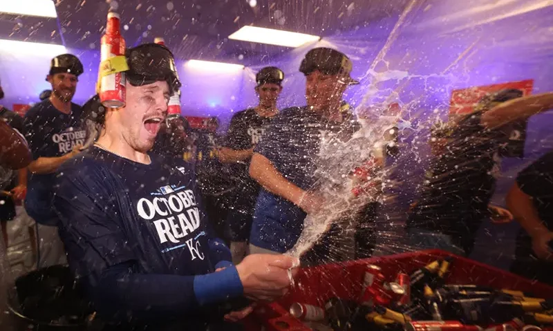 Bobby Witt Jr. #7 of the Kansas City Royals celebrates in the locker room after defeating the Baltimore Orioles in the Wild Card Series at Oriole Park at Camden Yards on October 02, 2024 in Baltimore, Maryland. (Photo by Patrick Smith/Getty Images)