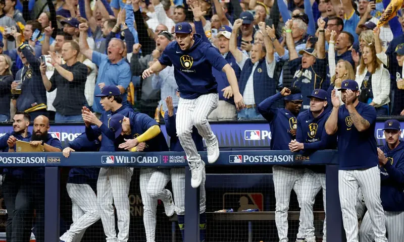 The Milwaukee Brewers celebrate after beating the New York Mets 5-3 in Game Two of the Wild Card Series at American Family Field on October 02, 2024 in Milwaukee, Wisconsin. (Photo by John Fisher/Getty Images)