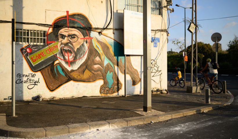 TEL AVIV ISRAEL - OCTOBER 05: Street art by Liran Tapiro depicting Hezbollah leader Sayyed Hassan Nasrallah featuring a target symbol and "Game Over" is seen on October 05, 2024 in Tel Aviv, Israel. Nasrallah was killed on September 27, 2024 during an Israeli airstrike on the Hezbollah headquarters in Beirut. On October 7, 2023, members of Hamas mounted a series of attacks and raids on Israeli citizens in the Gaza Envelope border area of Israel. 251 Israelis and foreigners were kidnapped with nearly 100 still unaccounted for and 1139 people were killed. (Photo by Leon Neal/Getty Images)