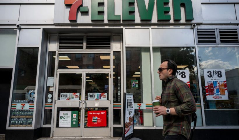A person walks past a 7-Eleven convenience store in New York City on October 9, 2024. The Japanese owner of 7-Eleven said on Wednesday it had received a "revised" takeover offer from Canadian rival Alimentation Couche-Tard after rejecting an initial bid worth around $40 billion. 7-Eleven is the world's biggest convenience store chain and has more than 85,000 outlets worldwide, around a quarter of those in Japan. (Photo by ANGELA WEISS / AFP) (Photo by ANGELA WEISS/AFP via Getty Images)