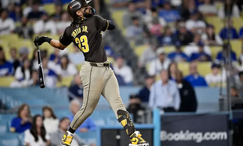 Fernando Tatis Jr. #23 of the San Diego Padres hits a home run in the ninth inning against the Los Angeles Dodgers during Game Two of the Division Series at Dodger Stadium on October 06, 2024 in Los Angeles, California. (Photo by Orlando Ramirez/Getty Images)