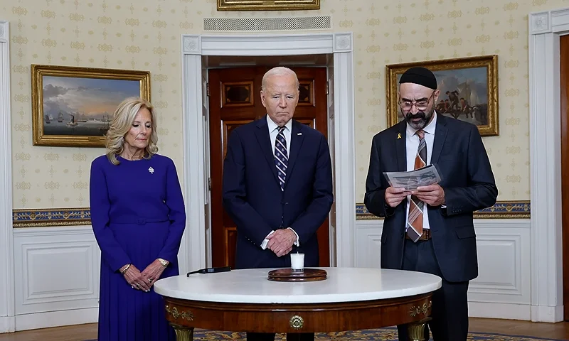 WASHINGTON, DC - OCTOBER 07: U.S. President Joe Biden participates in a remembrance ceremony with first lady Jill Biden and Rabbi Aaron Alexander (R) of Adas Israel Congregation on the one-year anniversary of the Hamas attack on Israel in the Blue Room at the White House on October 07, 2024 in Washington, DC. On October 7, 2023 Hamas carried out a surprise attack in Israel, killing more than 1,200 and taking about 250 hostage, according to Israeli officials. It was the bloodiest day in Jewish history since the end of the Holocaust. (Photo by Kevin Dietsch/Getty Images)