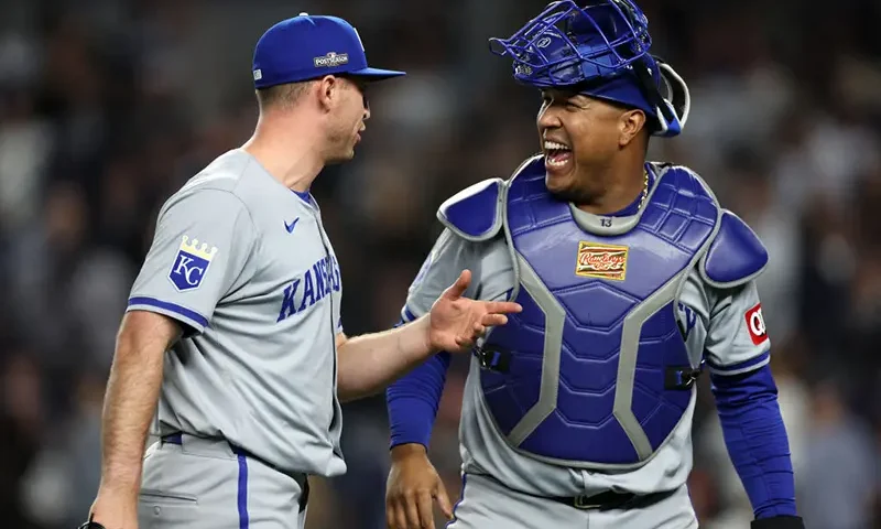 Kris Bubic #50 and Salvador Perez #13 of the Kansas City Royals react after the end of the eighth inning against the New York Yankees during Game Two of the Division Series at Yankee Stadium on October 07, 2024 in New York City. (Photo by Elsa/Getty Images)