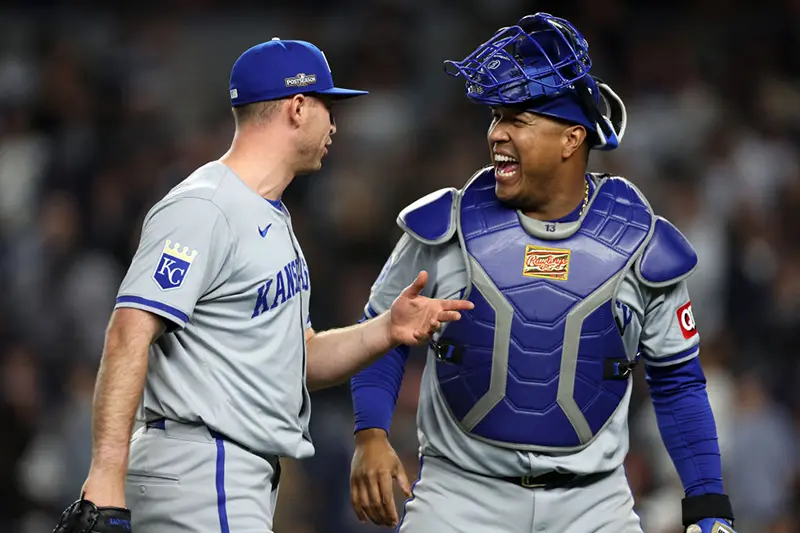 Kris Bubic #50 and Salvador Perez #13 of the Kansas City Royals react after the end of the eighth inning against the New York Yankees during Game Two of the Division Series at Yankee Stadium on October 07, 2024 in New York City. (Photo by Elsa/Getty Images)