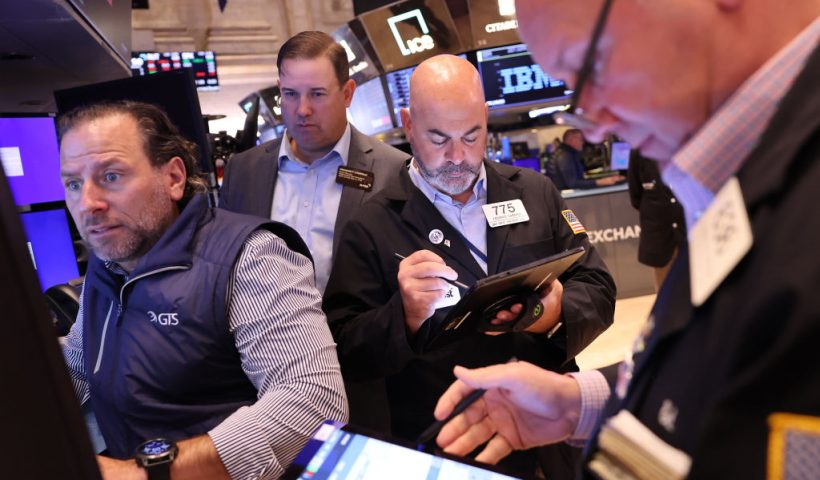 NEW YORK, NEW YORK - OCTOBER 08: Traders work on the floor of the New York Stock Exchange during morning trading on October 08, 2024 in New York City. Stocks opened up on the rise after the Dow Jones saw a loss of 400 points amid a rise in oil prices. (Photo by Michael M. Santiago/Getty Images)