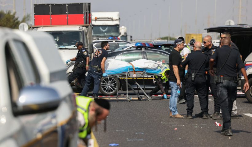 Members of Israel's ZAKA search and rescue emergency services transport a body, reportedly of the attacker, at the site of a shooting which killed a policeman and wounded four other people on the Yavne interchange near the southern Israeli city of Ashdod on October 15, 2024. (Photo by AHMAD GHARABLI / AFP) (Photo by AHMAD GHARABLI/AFP via Getty Images)