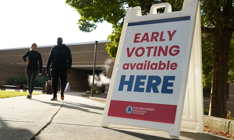 ATLANTA, GEORGIA - OCTOBER 15: Signs direct people where to go to cast their votes on the first day of early voting at Atlanta Metropolitan State College on October 15, 2024 in Atlanta, Georgia. Early voting takes place from October 15 - November 1, ahead of Election Day on November 5. (Photo by Megan Varner/Getty Images)