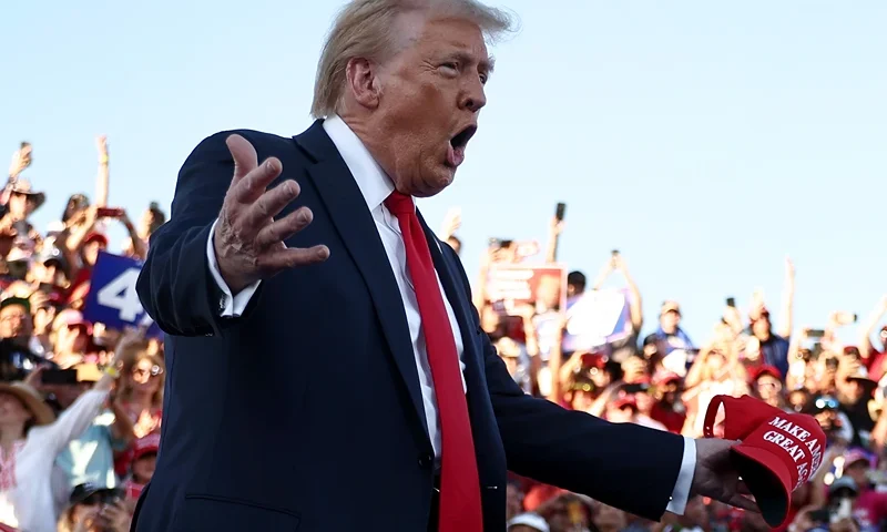 COACHELLA, CALIFORNIA - OCTOBER 12: Republican presidential nominee, former U.S. President Donald Trump gestures as he walks onstage for a campaign rally on October 12, 2024 in Coachella, California. With 24 days to go until election day, former President Donald Trump is detouring from swing states to hold the rally in Democratic presidential nominee, Vice President Kamala Harris' home state. (Photo by Mario Tama/Getty Images)