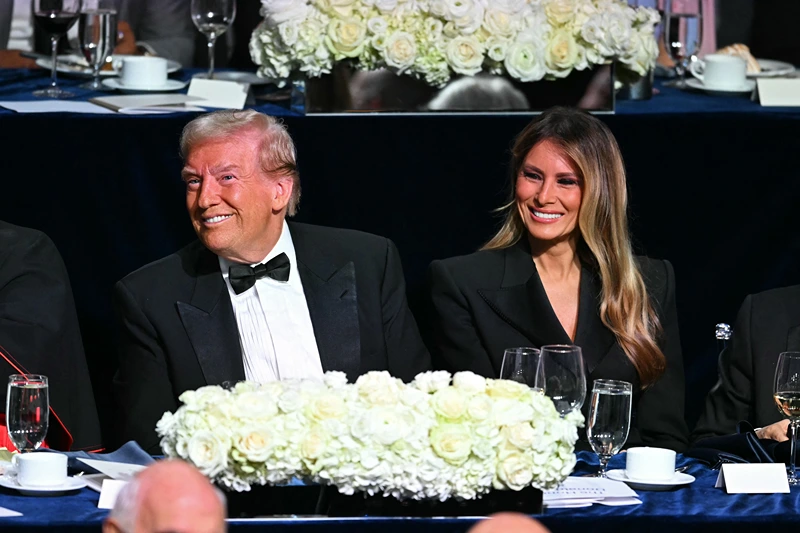 Former US President and Republican presidential candidate Donald Trump (L) and former US First Lady Melania Trump attend the 79th Annual Alfred E. Smith Memorial Foundation Dinner at the Hilton Midtown in New York, October 17, 2024. (Photo by Timothy A. CLARY / AFP) (Photo by TIMOTHY A. CLARY/AFP via Getty Images)