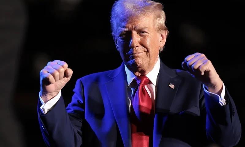 Republican presidential nominee, former U.S. President Donald Trump, greets Tommy "Hitman" Hearns during a campaign rally on October 18, 2024, in Detroit, Michigan. There are 17 days remaining until the U.S. presidential election, which will take place on Tuesday, November 5, 2024. (Photo by Win McNamee/Getty Images)