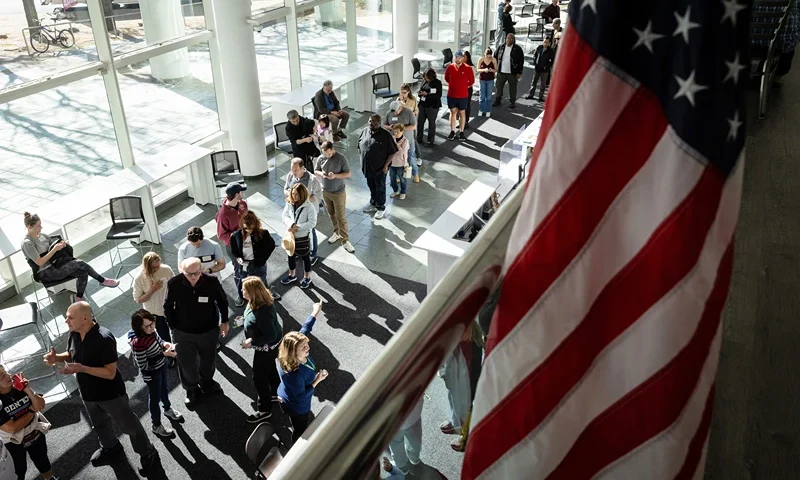 STAMFORD, CONNECTICUT - OCTOBER 21: Voters line up to cast their ballots at the Stamford Government Center on the first day of early voting on October 21, 2024 in Stamford, Connecticut. This is the first time that Connecticut residents can vote early in a presidential election, following a state constitutional amendment approved by voters in 2022. Voters have access to at least one location in each of the state's 169 municipalities until Sunday, November 3. Early voting hours will run most days from 10 a.m. until 6 p.m. (Photo by John Moore/Getty Images)