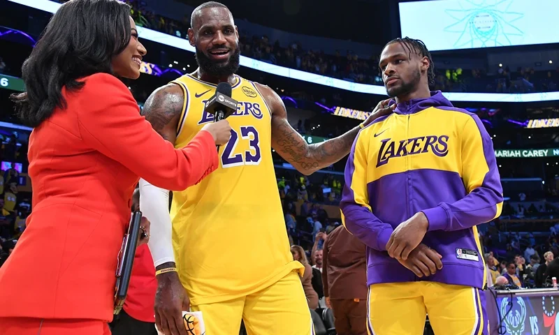 LOS ANGELES, CALIFORNIA - OCTOBER 22: LeBron James #23 and Bronny James #9 of the Los Angeles Lakers are interviewed after the game against the Minnesota Timberwolves at Crypto.com Arena on October 22, 2024 in Los Angeles, California. NOTE TO USER: User expressly acknowledges and agrees that, by downloading and or using this photograph, User is consenting to the terms and conditions of the Getty Images License Agreement. (Photo by Allen Berezovsky/Getty Images)