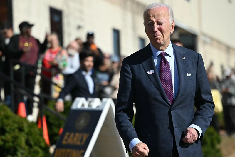 US President Joe Biden arrive to speak to reporters after casting his early-voting ballot in the 2024 general election in New Castle, Delaware, October 28, 2024. (Photo by ANDREW CABALLERO-REYNOLDS / AFP) (Photo by ANDREW CABALLERO-REYNOLDS/AFP via Getty Images)