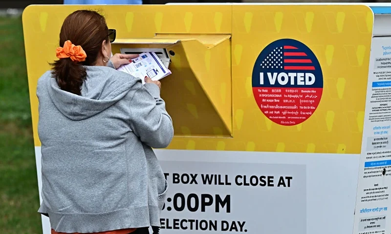 People drop off their ballots at the Los Angeles County Registrar on October 28, 2024, in Norwalk, California, two days after early voting in Los Angeles County began. Millions of US voters have already cast their ballots either by mail and drop-off boxes or in-person early voting ahead of the November 5 US presidential elections. (Photo by Frederic J. BROWN / AFP) (Photo by FREDERIC J. BROWN/AFP via Getty Images)