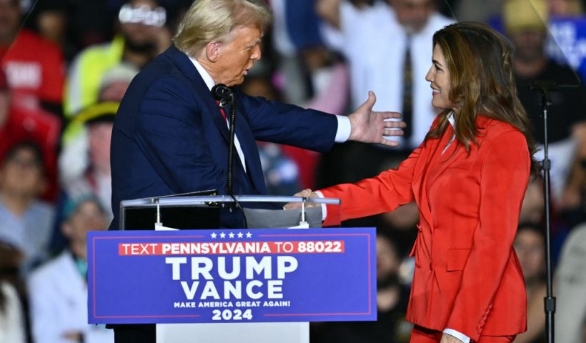 US Shadow Senator from Puerto Rico, Zoraida Buxo Santiago. greets former US President and Republican presidential candidate Donald Trump during a campaign rally at the PPL Center in Allentown, Pennsylvania, on October 29, 2024. (Photo by ANGELA WEISS / AFP) (Photo by ANGELA WEISS/AFP via Getty Images)