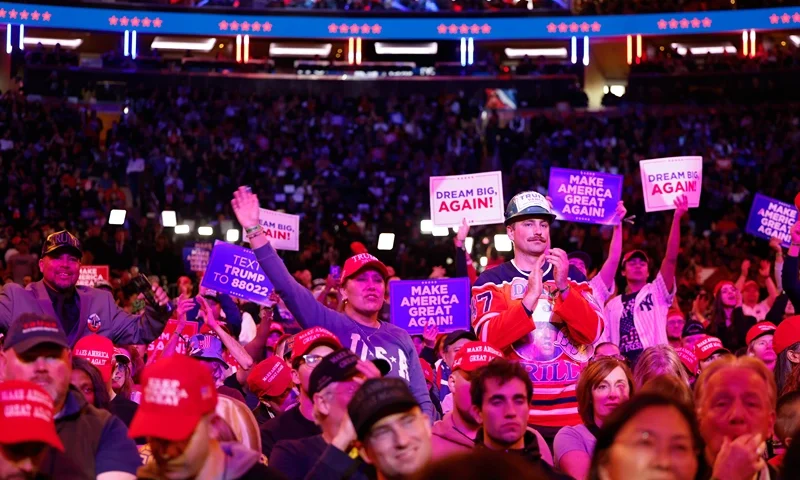 : Supporters of Republican presidential nominee, former U.S. President Donald Trump cheer speakers before he takes the stage at the campaign rally at Madison Square Garden on October 27, 2024 in New York City. Trump closed out his weekend of campaigning in New York City with a guest list of speakers that includes his running mate Republican vice presidential nominee, U.S. Sen. J.D. Vance (R-OH), Tesla CEO Elon Musk, UFC CEO Dana White, and House Speaker Mike Johnson (R-LA), among others, nine days before Election Day. (Photo by Anna Moneymaker/Getty Images)
