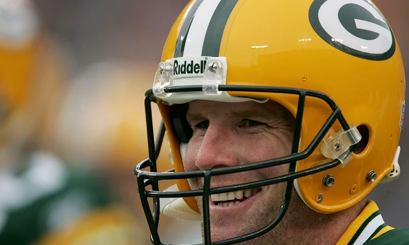 GREEN BAY, WI - JANUARY 1: Brett Favre #4 of the Green Bay Packers smiles as he walks off the field prior to the start of a game against the Seattle Seahawks January 1, 2006 at Lambeau Field in Green Bay, Wisconsin. (Photo by Jonathan Daniel/Getty Images)