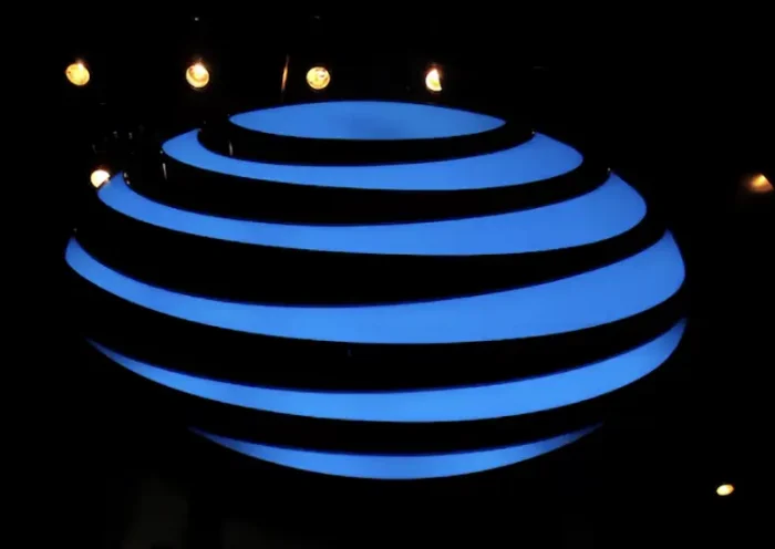 The AT&T logo is seen in a store window, as airports around the country are awaiting for Verizon and AT&T to rollout their 5G technology, in the Manhattan borough of New York City, New York, U.S., January 19, 2022. REUTERS/Brendan McDermid/File Photo