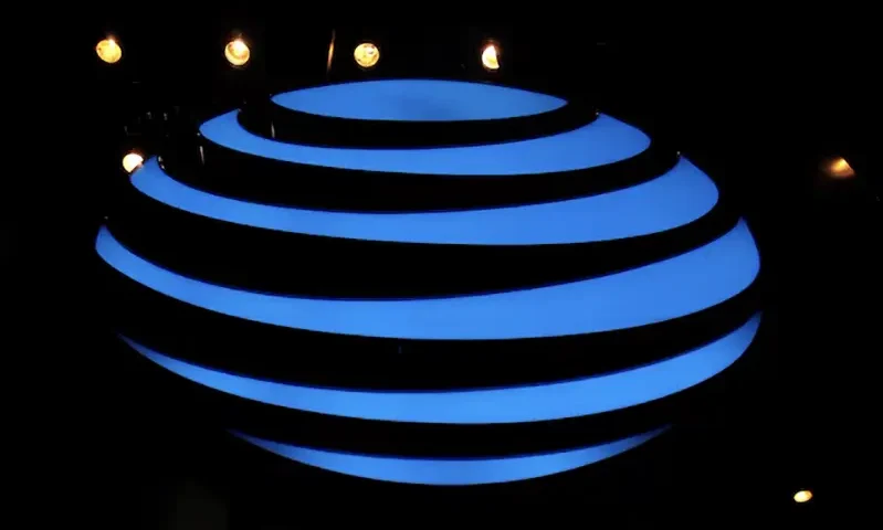 The AT&T logo is seen in a store window, as airports around the country are awaiting for Verizon and AT&T to rollout their 5G technology, in the Manhattan borough of New York City, New York, U.S., January 19, 2022. REUTERS/Brendan McDermid/File Photo
